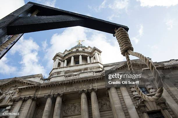 Protesters, many from far-right political organisations, erect a gallows as they demonstrate outside the Old Bailey before the sentencing of Michael...
