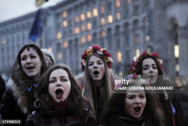 Young girls chant the Ukrainian national anthem at Independence square in central Kiev on February 26, 2014. Ukraine's pro-Western interim leaders...