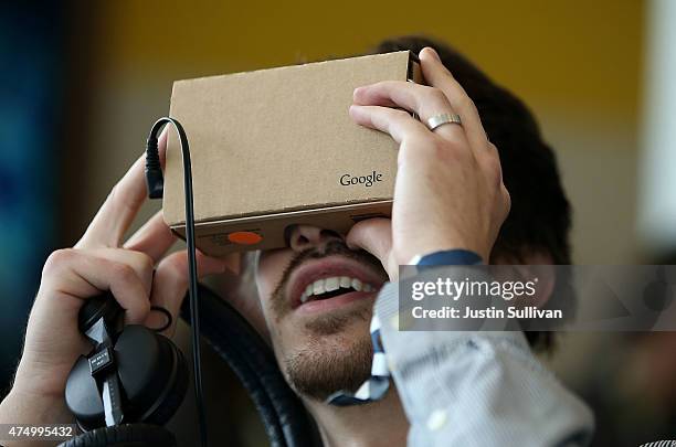 An attendee inspects Google Cardboard during the 2015 Google I/O conference on May 28, 2015 in San Francisco, California. The annual Google I/O...