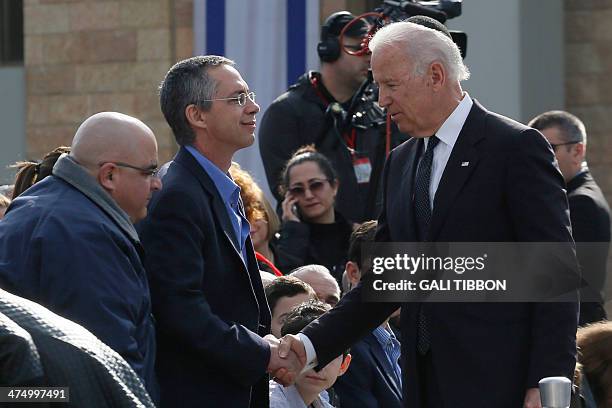Vice President Joe Biden shakes hand with Gilad and Omri Sharn the sons of former Israeli prime minister Ariel Sharon during the state memorial...