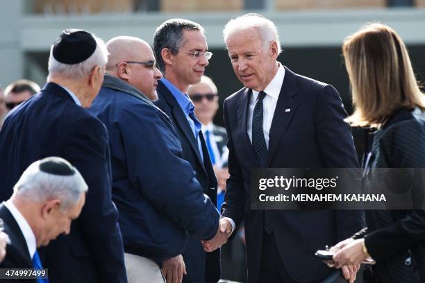Vice President Joe Biden greets the sons of Ariel Sharon, Omri and Gilad at the start of a state memorial ceremony for former Israeli prime minister...