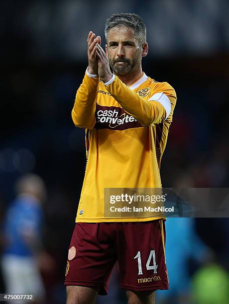 Keith Lasley of Motherwell acknowledges the support at full time during the Scottish Premiership play off final, first leg match between Rangers and...