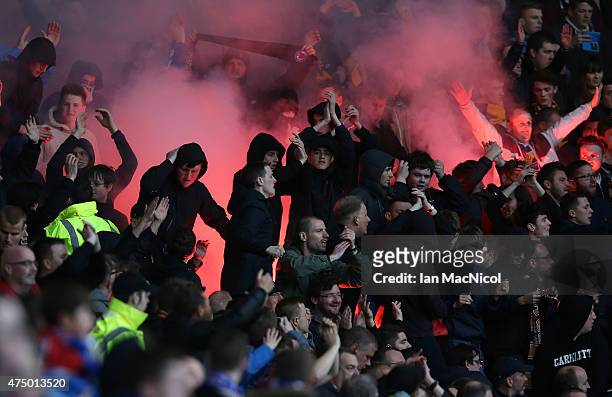 Motherwell supporters set off flares during the Scottish Premiership play off final, first leg match between Rangers and Motherwell at Ibrox Stadium...