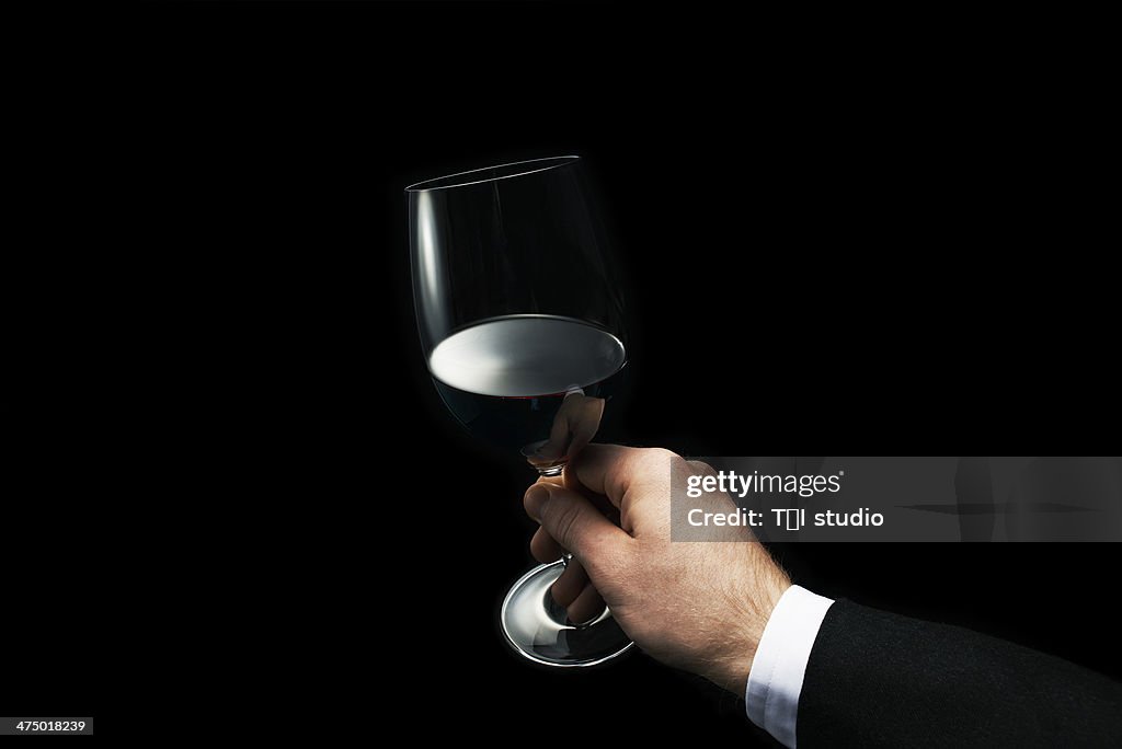 Man Holding A Glass of Red Wine