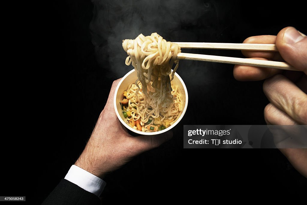 Man Eating Noodles