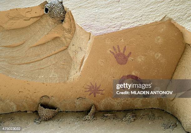 Pictographs called Super-Nova made by Ancient Puebloan People are seen on the rocks at Chaco Culture National Historical Park on May 21, 2015. AFP...