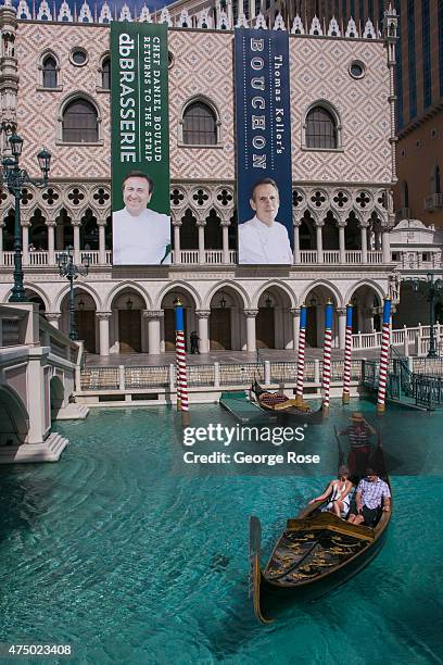 Visitors ride a gondola on the Grand Canal at The Venetian Las Vegas on May 17, 2015 in Las Vegas, Nevada. Tourism in America's "Sin City" has,...