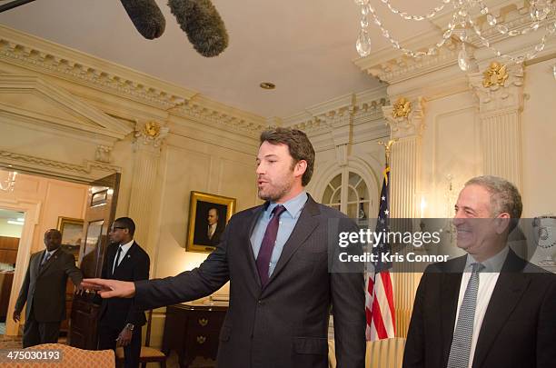 Beb Affleck and former U.S. Sen. Russ Feingold speak during a photo op at The State Department on February 26, 2014 in Washington, DC. Affleck,...