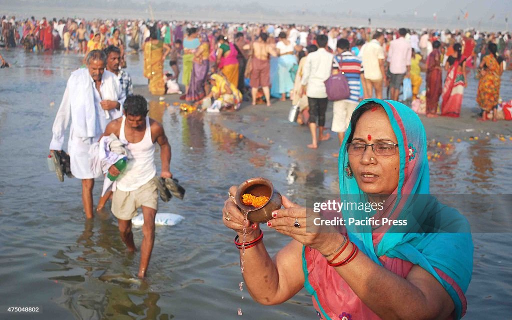 Hindu devotee take holy dips at the Sangam, the confluence...