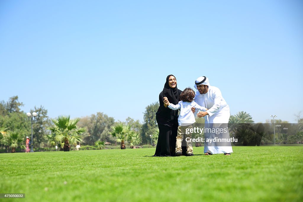 Arab family enjoying their leisure time in park