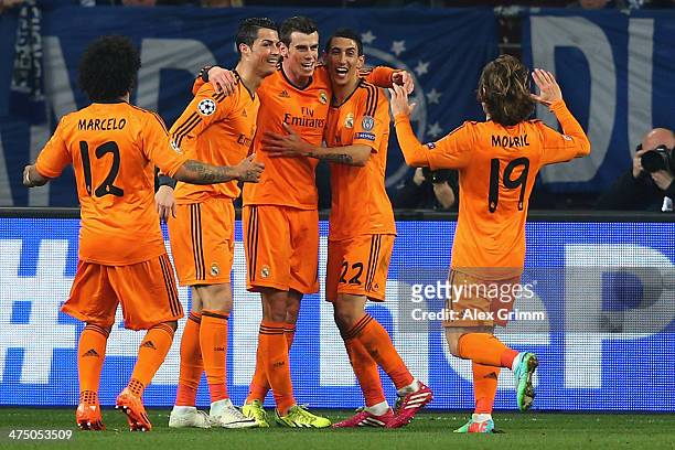 Gareth Bale of Madrid celebrates his team's second goal with team mates Marcelo, Karim Benzema, Angel Di Maria and Luka Modric during the UEFA...
