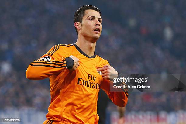 Cristiano Ronaldo of Madrid celebrates his team's third goal during the UEFA Champions League Round of 16 first leg match between FC Schalke 04 and...
