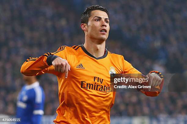 Cristiano Ronaldo of Madrid celebrates his team's third goal during the UEFA Champions League Round of 16 first leg match between FC Schalke 04 and...