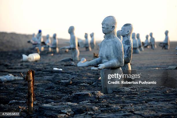 Survivors statues are displayed at mudflow areas to signify the lives of victims who suffered during ninth anniversary of the Lapindo mudflow...