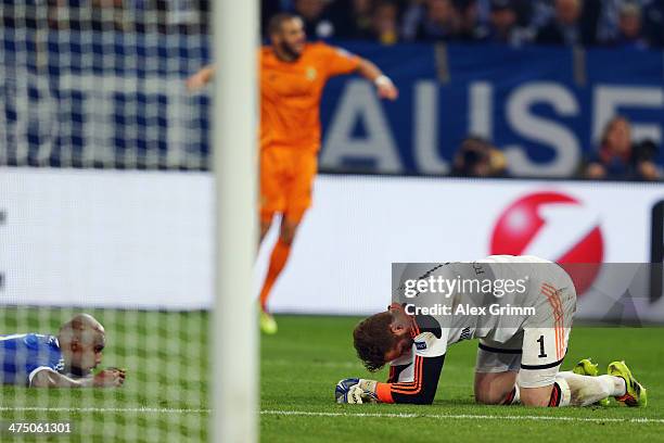 Goalkeeper Ralf Faehrmann and Felipe Santana of Schalke react as Karim Benzema of Madrid celebrates his team's fourth goalduring the UEFA Champions...