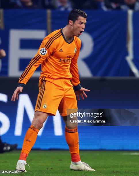 Cristiano Ronaldo of Madrid celebrates his team's sixth goal during the UEFA Champions League Round of 16 first leg match between FC Schalke 04 and...