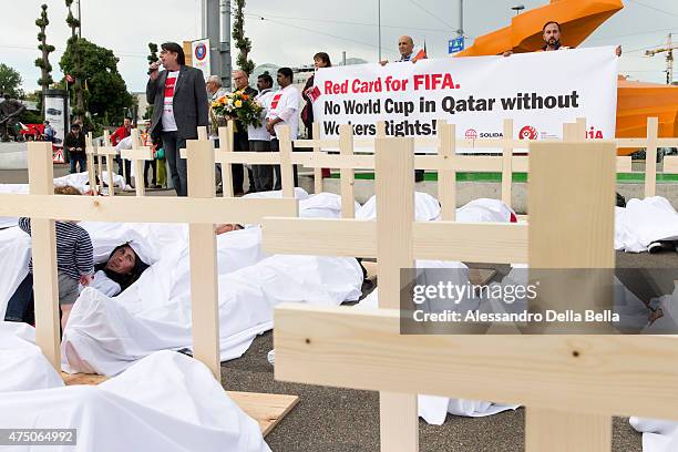 Activists are pictured during a protest called "Red Card for FIFA. No World Cup in Qatar without Workers rights!" and organized by the Swiss trade...