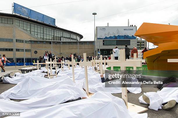 Activists are pictured during a protest called "Red Card for FIFA. No World Cup in Qatar without Workers rights!" and organized by the Swiss trade...