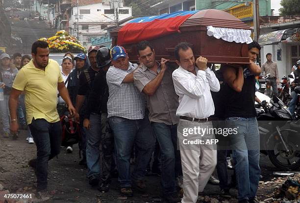 Relatives of Jimmy Vargas, a student who died during a recent protest, carry his coffin during his funeral in San Cristobal, 660 km from Caracas,...