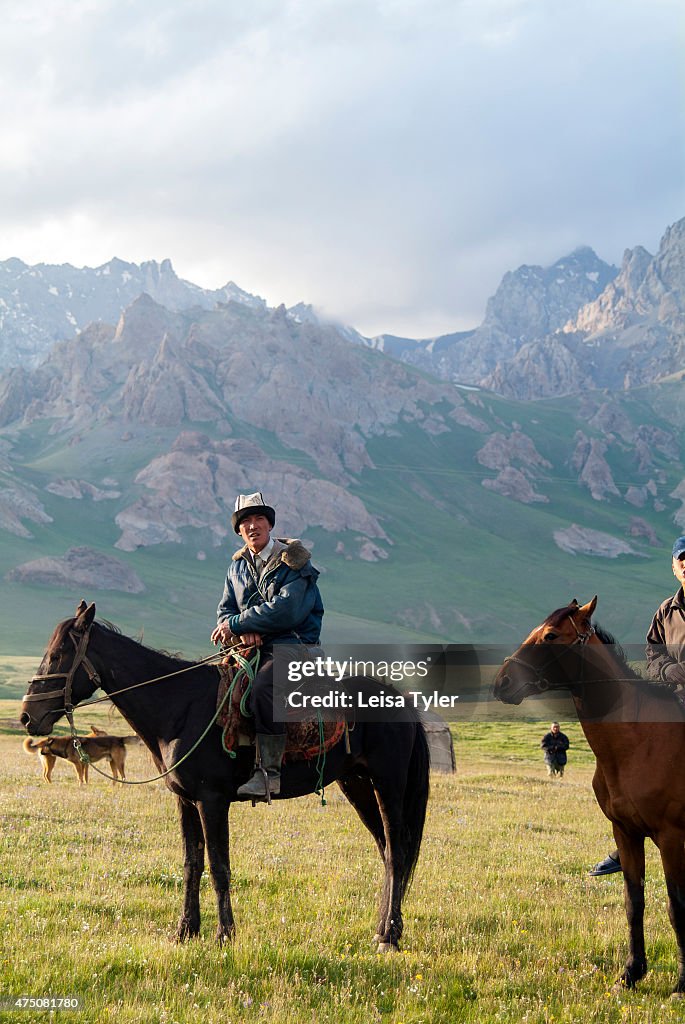 Shepherds in the Alay Valley in southern Kyrgyzstan. Sitting...