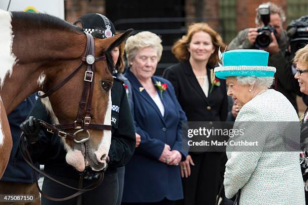 Queen Elizabeth II visits Lodge Livery and Dairy Yard on May 29, 2015 in Lancaster, England.