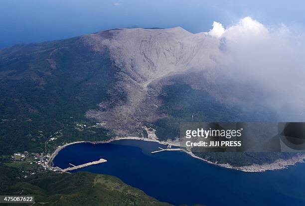 An aerial view taken on May 29, 2015 shows smoke rising from Mount Shindake on Kuchinoerabu island in Kagoshima prefecture of Japan's southern island...