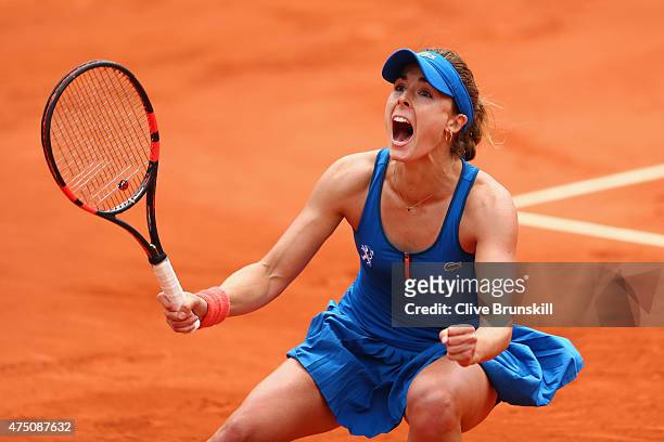 Alize Cornet of France celebrates match point in her Women's Singles match against Mirjana Lucic-Baroni of Croatia on day six of the 2015 French Open...