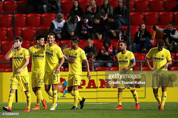 Gerard Moreno Balaguero of Villarreal CF celebrates with his team mates after scoring the winning goal during the international friendly match...