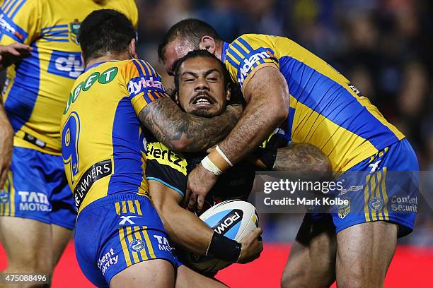 Sika Manu of the Panthers is tackled during the round 12 NRL match between Penrith Panthers and the Parramatta Eels at Pepper Stadium on May 29, 2015...