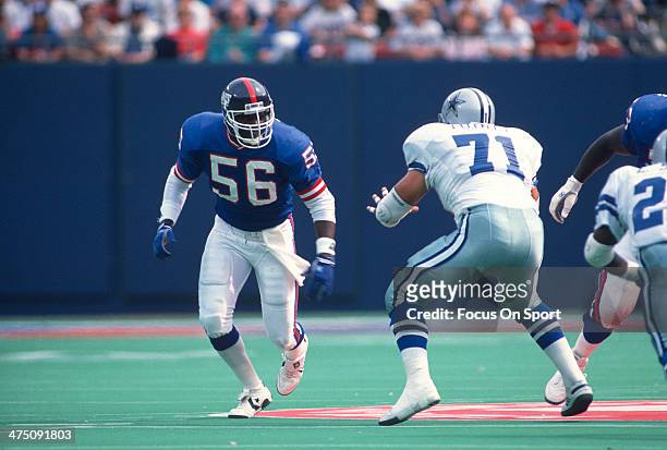 Lawrence Taylor of the New York Giants in action against the Dallas Cowboys during an NFL football game September 30, 1990 at The Meadowlands in East...