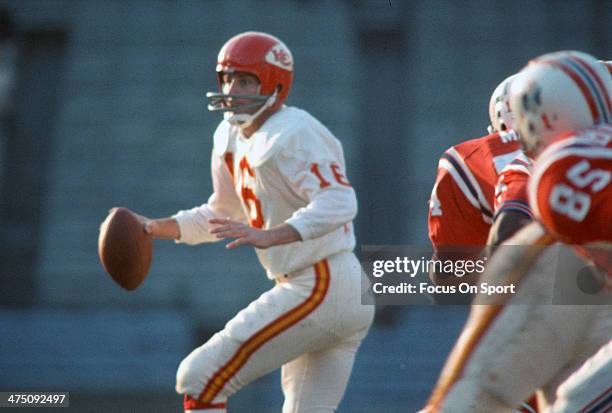 Len Dawson of the Kansas City Chiefs drops back to pass against the Boston Patriots during an AFL Football game September 25, 1966 at Fenway Park in...