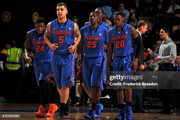 Casey Prather, Scottie Wilbekin, DeVon Walker, and Michael Frazier II of the Florida Gators play against the Vanderbilt Commodores at Memorial Gym on...