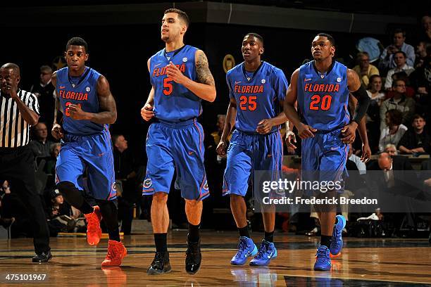 Casey Prather, Scottie Wilbekin, DeVon Walker, and Michael Frazier II of the Florida Gators play against the Vanderbilt Commodores at Memorial Gym on...