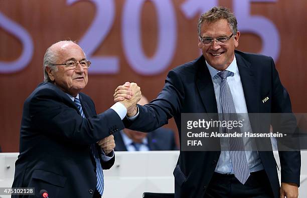 Secretary General Jerome Valcke shakes hands with FIFA President Joseph S. Blatter during the 65th FIFA Congress at the Hallenstadion on May 29, 2015...