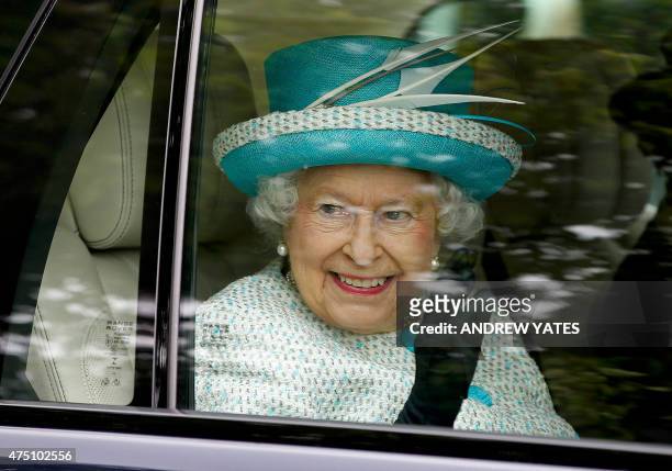 Britain's Queen Elizabeth II smiles as she leaves after her visit Myerscough College in Lancaster, northern England on May 29 where, in her role as...
