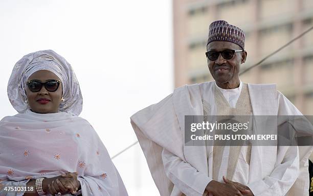 Nigerian President Mohammadu Buhari arrives with his wife Aisha, before taking oath of office at the Eagles Square in Abuja, on May 29, 2015. Buhari...