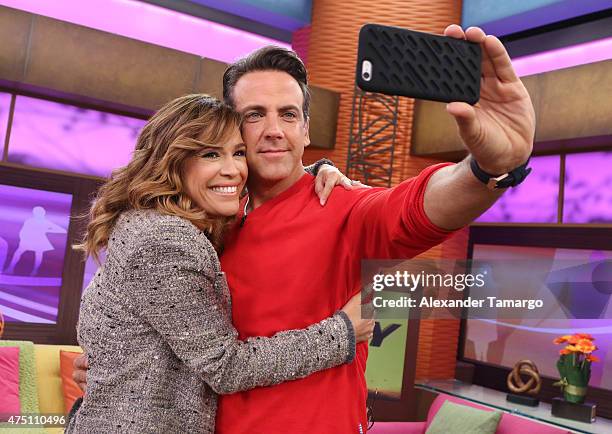 Karla Martinez and Carlos Ponce take a selfie on the set of "Despierta America" to promote his film "Spy" at Univision Studios on May 29, 2015 in...