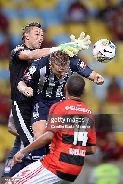 Wallace of Flamengo battles for the ball against goalkeeper Dreer and Nasuti of Emelec during a match between Flamengo and Emelec as part of Copa...