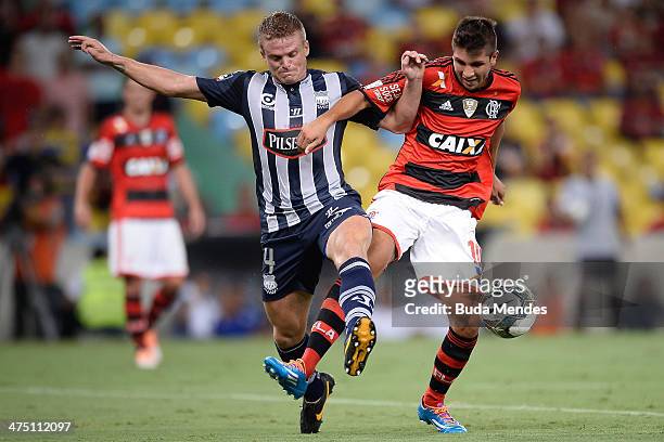 Lucas Mugni of Flamengo battles for the ball against Nasuti of Emelec during a match between Flamengo and Emelec as part of Copa Bridgestone...