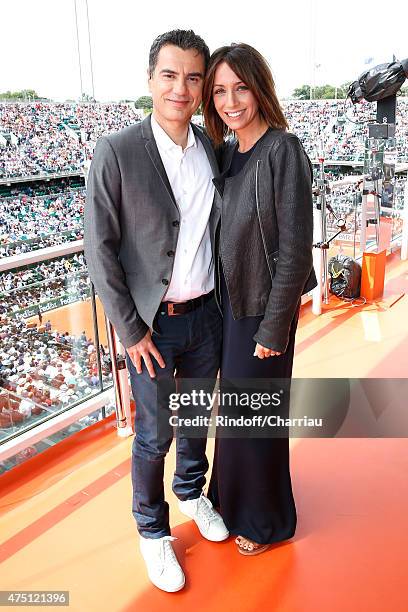 Sports journalist Laurent Luyat and TV Host Virginie Guilhaume pose at France Television french chanel studio during the 2015 Roland Garros French...