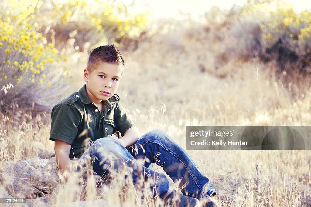 Boy Sitting Outside