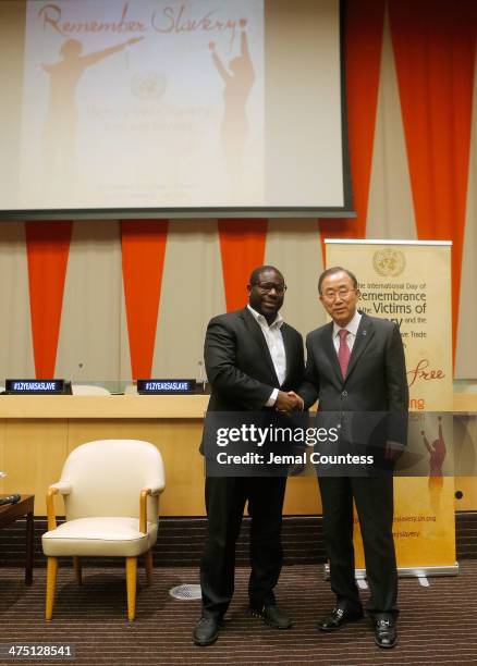 Director Steve McQueen and United Nations Secretary General Ban Ki-moon shake hands after a special screening of "12 Years A Slave" at the ECOSOC...