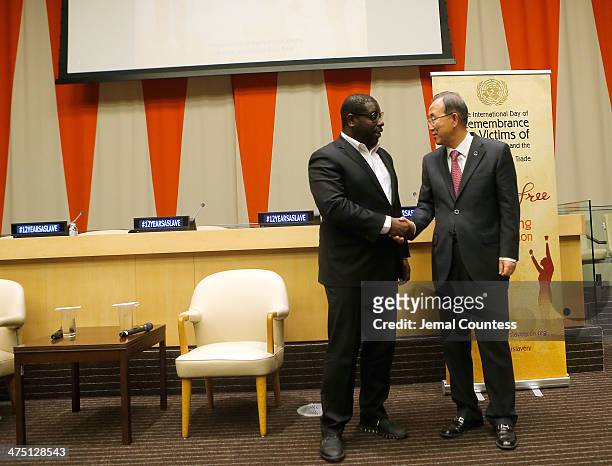 Director Steve McQueen and United Nations Secretary General Ban Ki-moon shake hands after a special screening of "12 Years A Slave" at the ECOSOC...
