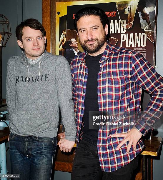 Actor Elijah Wood and director Eugenio Mira attend the "Grand Piano" screening at Nitehawk Cinema on February 26, 2014 in New York City.