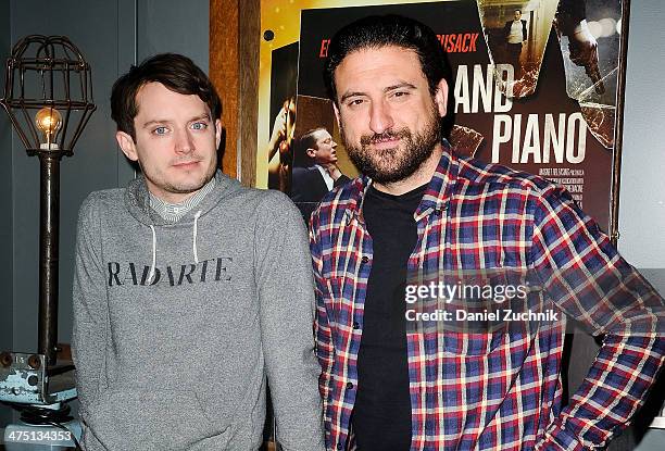 Actor Elijah Wood and director Eugenio Mira attend the "Grand Piano" screening at Nitehawk Cinema on February 26, 2014 in New York City.