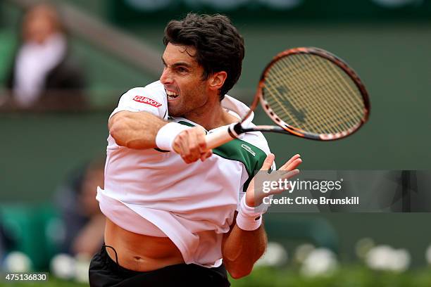 Pablo Andujar of Spain returns a shot in his Men's Singles match against Jo-Wilfried Tsonga of France on day six of the 2015 French Open at Roland...