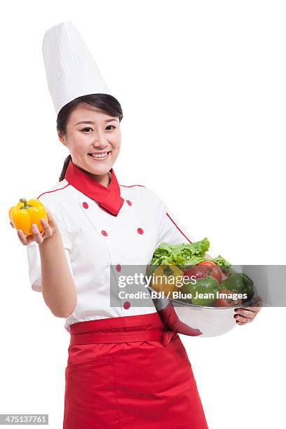 female cook with bell pepper - washing tub stockfoto's en -beelden