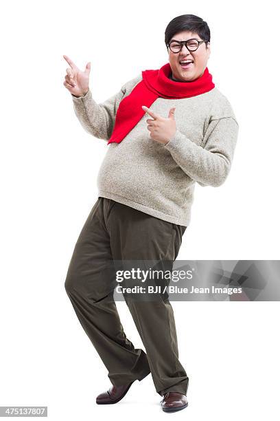 excited young man celebrating chinese new year - 25 year man ストックフォトと画像