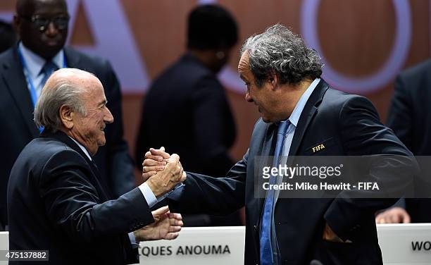 Joseph S. Blatter is congratulated by UEFA President Michel Platini of France as he is re-elected as FIFA President after Presidential candidate...