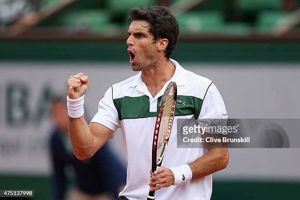 Pablo Andujar of Spain celebrates a point in his Men's Singles match against Jo-Wilfried Tsonga of France on day six of the 2015 French Open at...
